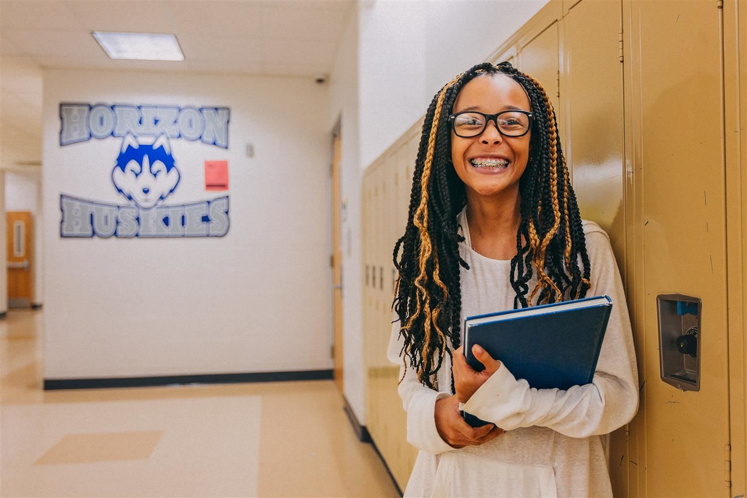 Middle School student holding a book 