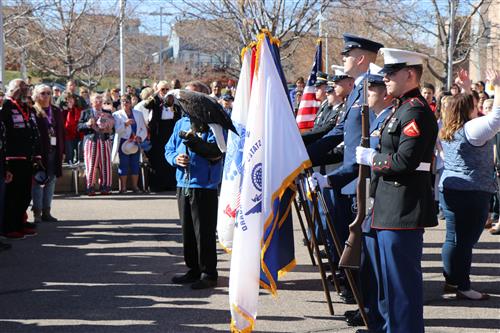 Service members and students celebrate at Sky Vista Middle School in November, 2017. 