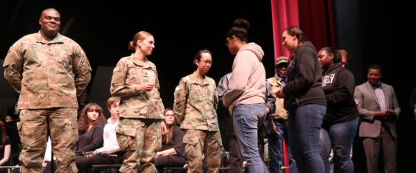Smoky Hill High School students honor veterans on stage. Smoky Hill High School students honor veterans on stage.