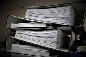 Four notebooks filled with pages 