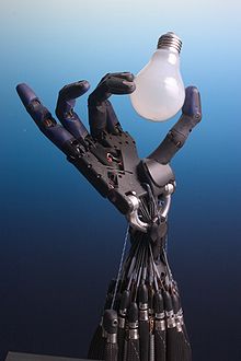 Robic arm holding light bulb 