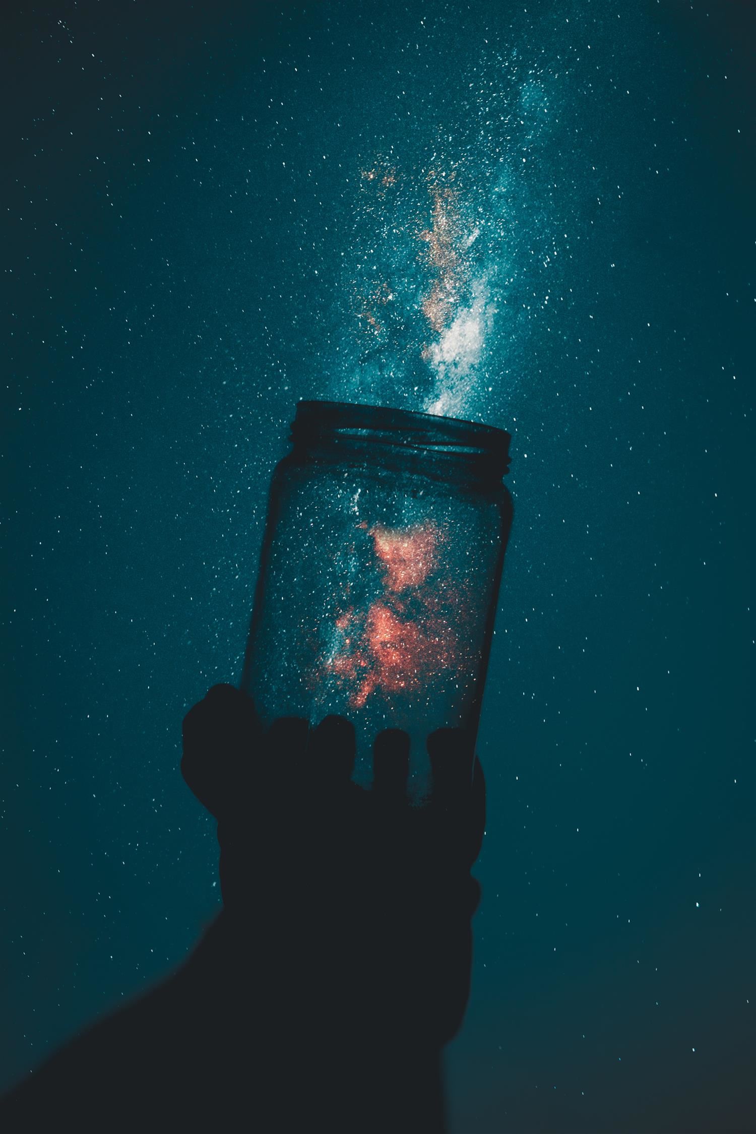 hand holding mason jar hand holding mason jar