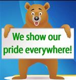 Bear holding sign: we show our pride everywhere 