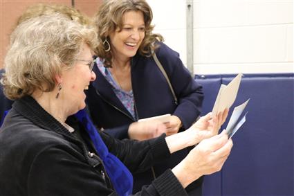 Shelia sharing photos with former colleagues