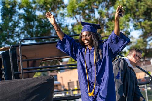 A graduate celebrates during the Cherokee Trail High School ceremony in July. 