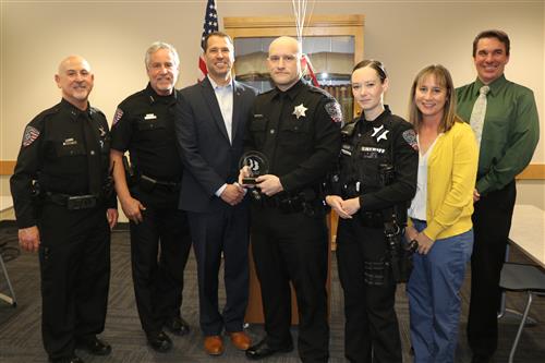 Deputy Ben Sadler poses with CCSD and Arapahoe County Sheriff's officials. 