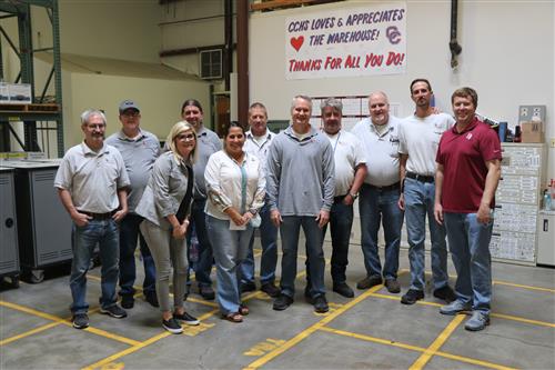 Greg Von Feldt and warehouse crew